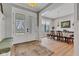 Stylish entryway with a glass-paneled front door, seamlessly connecting to the dining room area at 8146 W 875 S, Pendleton, IN 46064