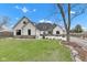 Charming two-story home with landscaped yard featuring lush green lawn and mature trees at 8146 W 875 S, Pendleton, IN 46064