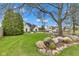 Landscaped front yard with lush green lawn surrounding a beautiful two-story home at 8146 W 875 S, Pendleton, IN 46064
