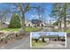 View of charming two-story home with detached four car garage and beautifully landscaped front yard at 8146 W 875 S, Pendleton, IN 46064