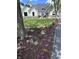 Landscaped front yard with colorful flowers and a lush green lawn surrounding a beautiful two-story home at 8146 W 875 S, Pendleton, IN 46064