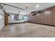 Spacious garage featuring a white Cadillac and ample storage with floor to ceiling built in cabinetry at 8146 W 875 S, Pendleton, IN 46064