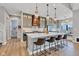 Modern kitchen featuring a large island with seating, pendant lighting, and custom cabinetry at 8146 W 875 S, Pendleton, IN 46064