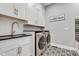 Laundry room featuring modern appliances, white cabinets, and ample counter space at 8146 W 875 S, Pendleton, IN 46064