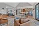 Open-concept living room featuring vaulted ceilings, wood floors, and seamless flow to the kitchen at 8146 W 875 S, Pendleton, IN 46064