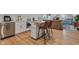 Open-concept living space featuring a modern kitchen area, sleek appliances, and a cozy lounge with ample natural light at 8146 W 875 S, Pendleton, IN 46064