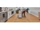 Open-concept living space featuring a modern kitchen area, sleek appliances, and a cozy lounge with ample natural light at 8146 W 875 S, Pendleton, IN 46064