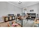 Bright office space with a wood desk, grand piano, comfortable chair, and decorative accents at 8146 W 875 S, Pendleton, IN 46064