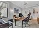 Well-lit office with large window, wood desk, and grand piano for a creative workspace at 8146 W 875 S, Pendleton, IN 46064