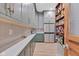 Walk-in pantry with custom shelving, stainless steel refrigerator, and patterned backsplash at 8146 W 875 S, Pendleton, IN 46064