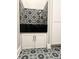 Tiled pet shower with built-in storage and black counters at 8146 W 875 S, Pendleton, IN 46064