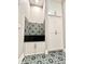 Pet shower with white cabinets and floral tiled accents at 8146 W 875 S, Pendleton, IN 46064