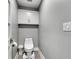 This well lit powder room features a toilet and built in wall cabinet for extra storage at 8146 W 875 S, Pendleton, IN 46064
