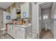 Well-organized utility room with ample counter space, cabinetry, and a convenient half-bathroom at 8146 W 875 S, Pendleton, IN 46064