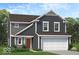 Charming two-story home with gray siding, white trim, and a well-manicured lawn at 8706 Hollander Dr, Camby, IN 46113