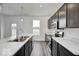 New kitchen features dark cabinets, white countertops and island with stainless steel appliances at 8706 Hollander Dr, Camby, IN 46113