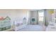 Brightly lit bedroom with work space, drawing easel and playful decor at 8710 Hollander Dr, Camby, IN 46113