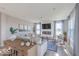 Cozy living room featuring a fireplace, TV, stylish decor, and plenty of natural light at 8710 Hollander Dr, Camby, IN 46113