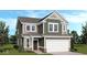 Charming two-story home with a two-car garage, green siding, and a well-manicured lawn at 8711 Hollander Dr, Camby, IN 46113