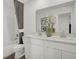 Elegant bathroom with double vanity, granite countertop, and modern fixtures offering luxury and convenience at 8893 Alexander Ridge Dr, McCordsville, IN 46055