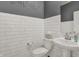 Chic half-bathroom featuring white subway tile, pedestal sink, and modern fixtures at 8893 Alexander Ridge Dr, McCordsville, IN 46055