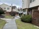 Exterior street view of residential neighborhood featuring townhomes and landscaped yards at 9452 Maple Way, Indianapolis, IN 46268