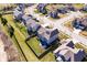 Overhead view of a fenced backyard with play equipment, solar panels, and neighborhood street at 10155 Pepper Tree Ln, Noblesville, IN 46060