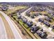 Wide aerial shot displaying a well-planned community with tree-lined streets and well-maintained homes at 10155 Pepper Tree Ln, Noblesville, IN 46060