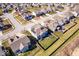 Aerial view of a neighborhood highlighting a home with a fenced yard, solar panels, and a play set at 10155 Pepper Tree Ln, Noblesville, IN 46060
