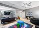Finished basement area with a seating area, vibrant rug, and fun decor for  at 10155 Pepper Tree Ln, Noblesville, IN 46060