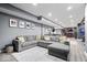 Finished basement includes a large sectional sofa and bar area at 10155 Pepper Tree Ln, Noblesville, IN 46060