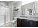 Bathroom vanity with granite countertop and a glass-enclosed shower at 10155 Pepper Tree Ln, Noblesville, IN 46060