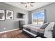 Comfortable bedroom with wood floors, large window, dresser, and a modern design at 10155 Pepper Tree Ln, Noblesville, IN 46060