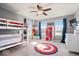 A well-lit bedroom with a bunk bed and playful decor, enhanced by natural light from dual windows at 10155 Pepper Tree Ln, Noblesville, IN 46060