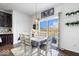 Bright dining area with sliding glass doors, pendant lighting, and a view of the backyard at 10155 Pepper Tree Ln, Noblesville, IN 46060