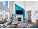 Cozy living room featuring a fireplace, tall ceilings, and comfortable seating at 10155 Pepper Tree Ln, Noblesville, IN 46060