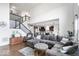 Open concept living room featuring hardwood floors, neutral colors, and access to the kitchen at 10155 Pepper Tree Ln, Noblesville, IN 46060