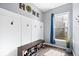 Mudroom features a shoe bench and storage with natural light from a window at 10155 Pepper Tree Ln, Noblesville, IN 46060
