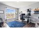 Office space featuring a large window with natural light, shelving, and a work area at 10155 Pepper Tree Ln, Noblesville, IN 46060