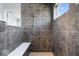 Bathroom shower with modern tile and built-in bench at 10155 Pepper Tree Ln, Noblesville, IN 46060