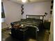 Bedroom featuring wood-look floors, a full sized bed, shelving and dresser with a trunk at the foot of the bed at 1016 Alden Dr, Fortville, IN 46040