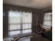 The living room has large windows and a grey wall, which provides natural light at 1016 Alden Dr, Fortville, IN 46040