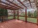 Back deck with pergola overlooking a lush backyard and green lawn at 10343 Waveland Cir, Fishers, IN 46038