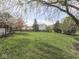 Beautiful backyard with lush lawn and shade trees providing a serene outdoor space at 10343 Waveland Cir, Fishers, IN 46038