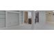 Spacious finished basement with built-in shelving and bonus room including updated carpet and neutral paint at 10343 Waveland Cir, Fishers, IN 46038