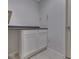 Finished basement features built-in white cabinets with dark countertops and neutral paint at 10343 Waveland Cir, Fishers, IN 46038