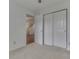 Bright bedroom features carpet flooring, closet, and view of stairs at 10343 Waveland Cir, Fishers, IN 46038