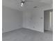 A bedroom with a door leading to another room, carpet, and ceiling fan at 10343 Waveland Cir, Fishers, IN 46038