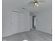 A well-lit bedroom featuring carpet, and double door closets for storage at 10343 Waveland Cir, Fishers, IN 46038