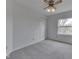 Bedroom with a closet, window, carpet and a ceiling fan with lights at 10343 Waveland Cir, Fishers, IN 46038